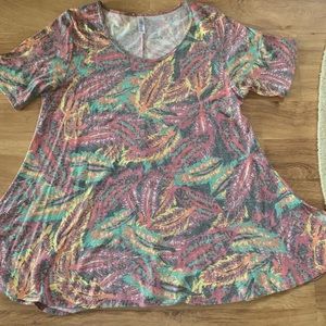 Stonewashed LuLaRoe multi colored swing blouse.